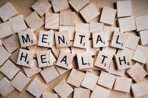 Scrabble tiles spelling out "mental health."